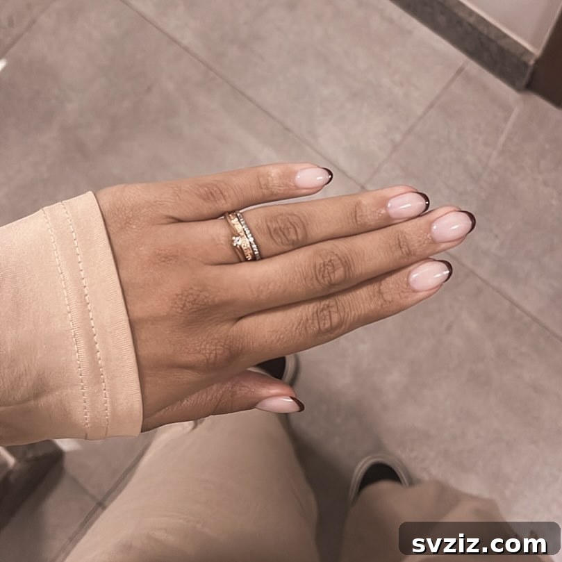 Chic Minimalist Nails with Cream Polish and Black French Tips