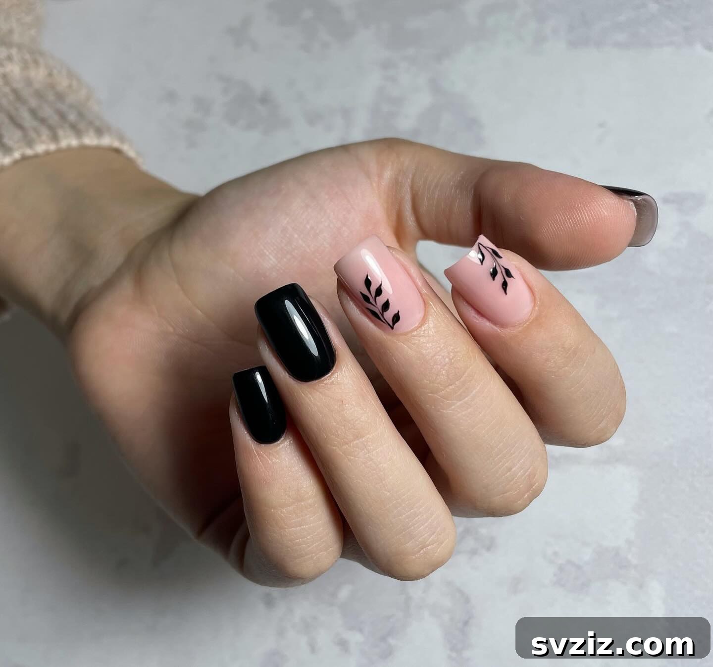 Romantic Soft Pink Nails with Bold Black Leaf Designs