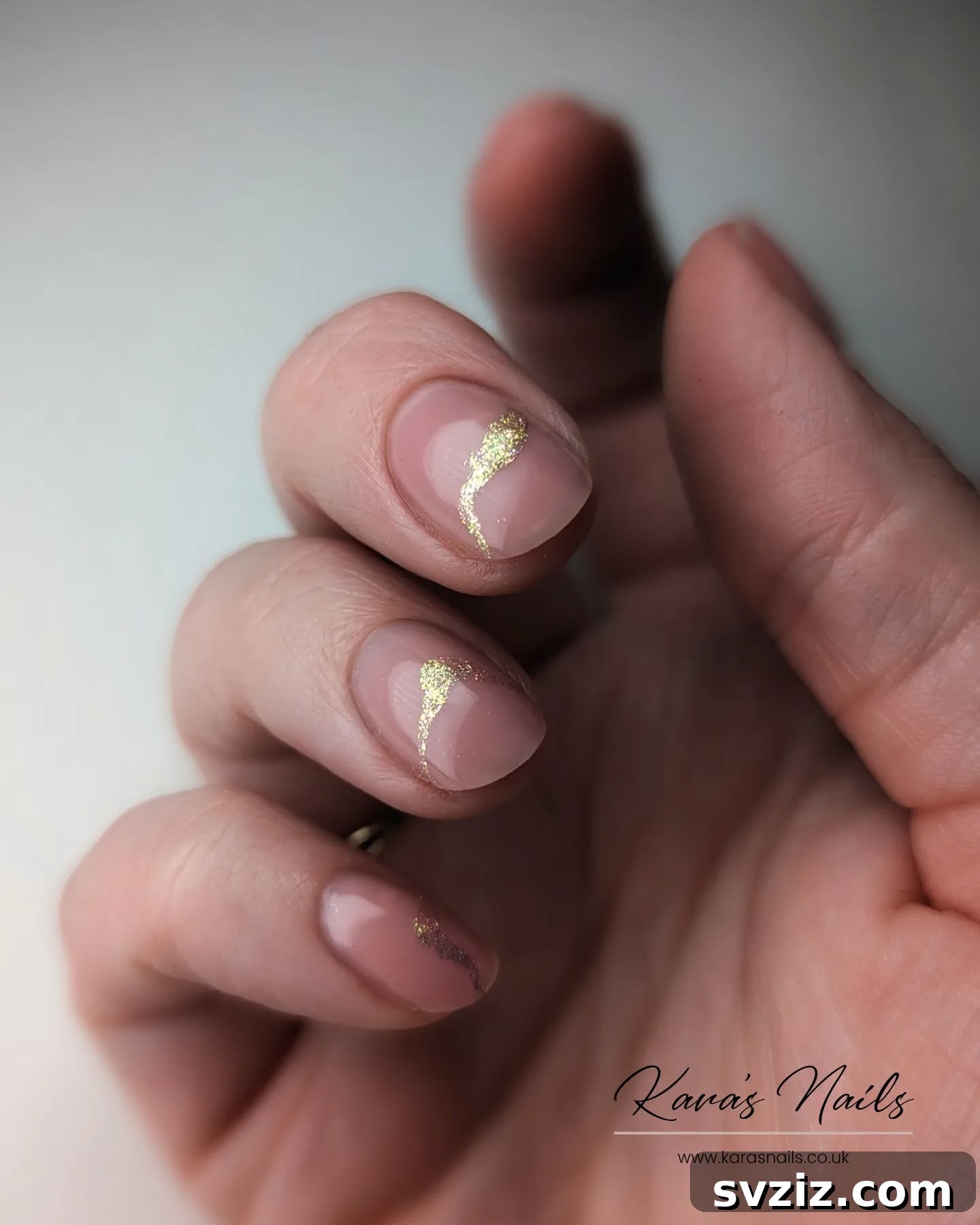 Glamorous Minimalist Nails with a Dazzling Gold Sparkle Accent