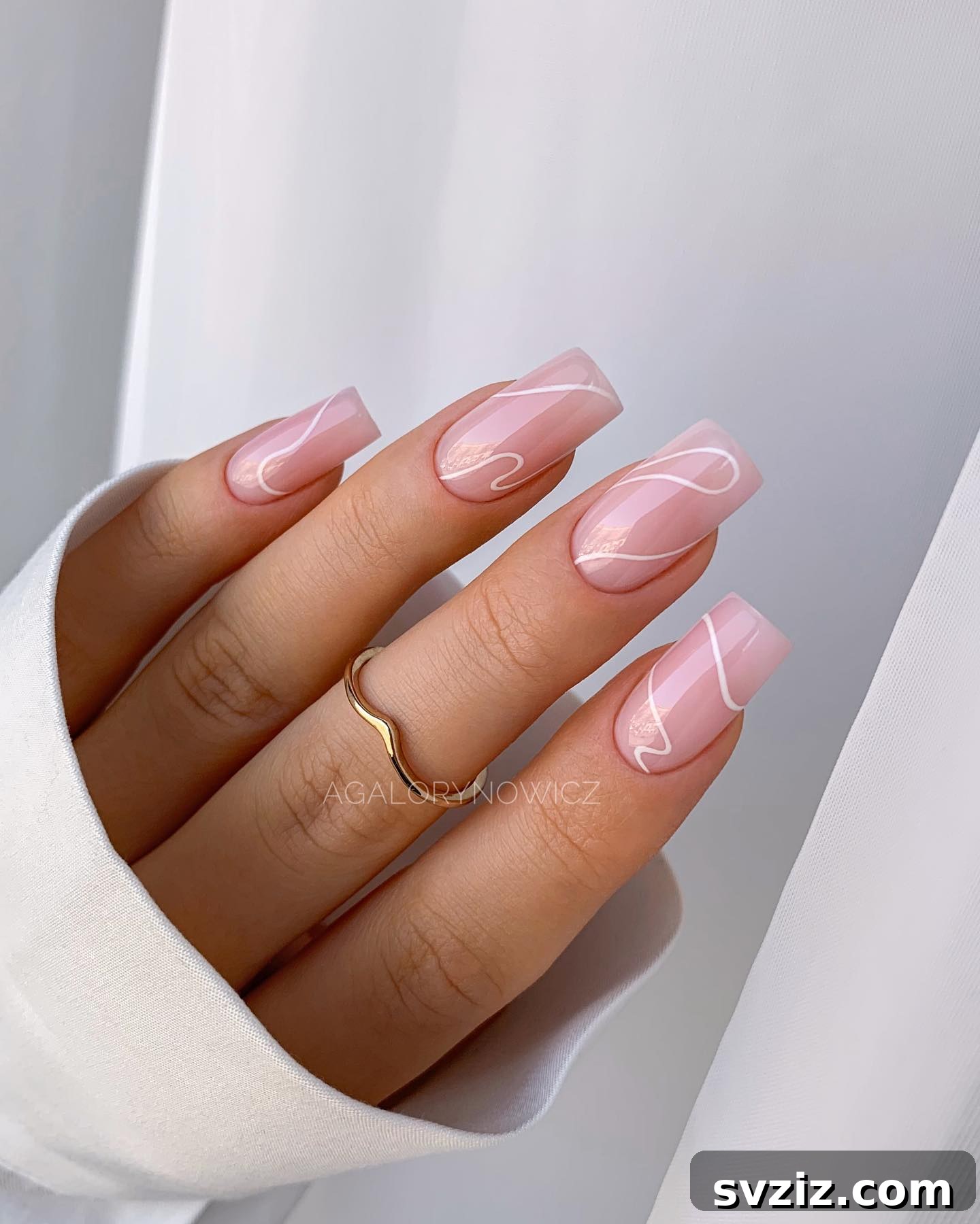 Soft Pink Minimalist Nails with Elegant White Swirl Designs