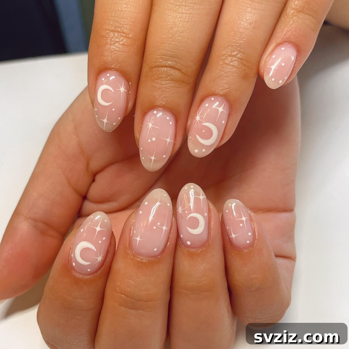 Nude Minimalist Nails with Intricate Moon and Star Details
