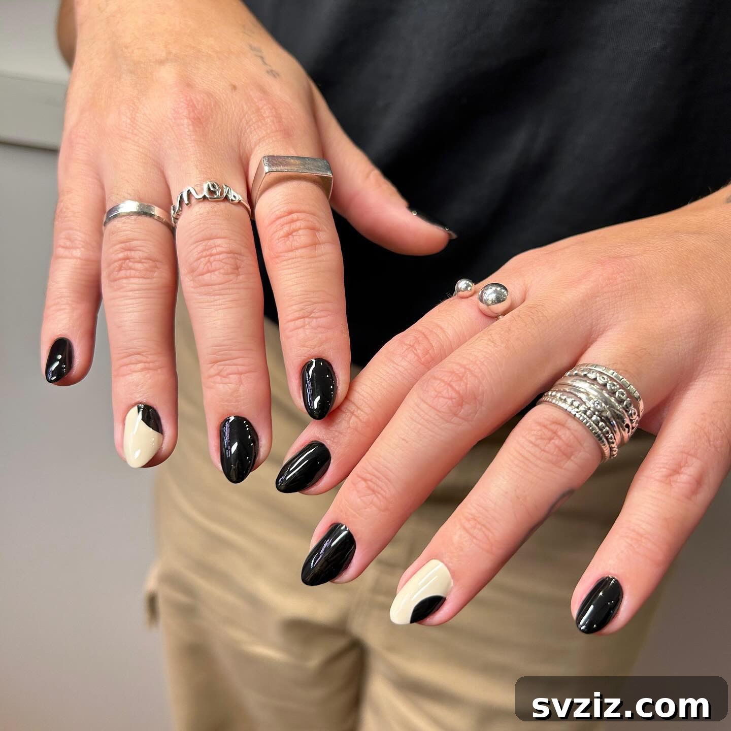 Sophisticated Black Minimalist Manicure with a Single White Accent Nail