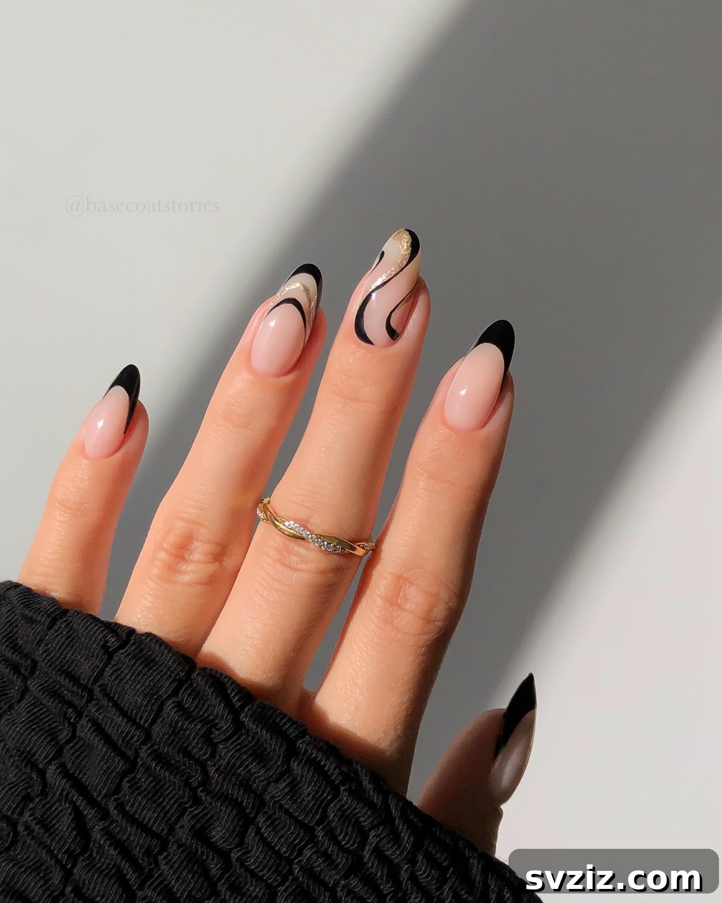 41 Chic and Elegant Nail Design Ideas 41 39. Nude Nails with Black and Gold Accents