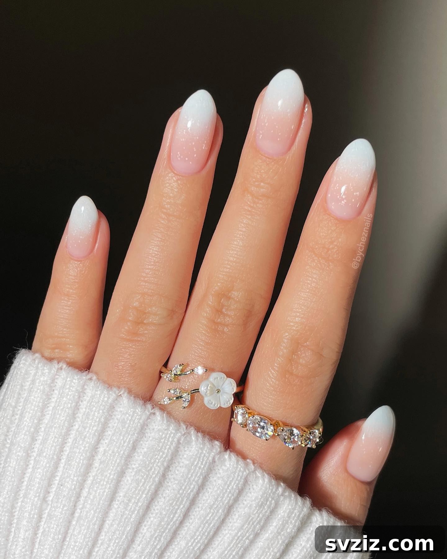 41 Effortless Nude Nail Ideas for Everyone 11 Sparkly snow gradient French tip nails, creating a dazzling winter wonderland effect.