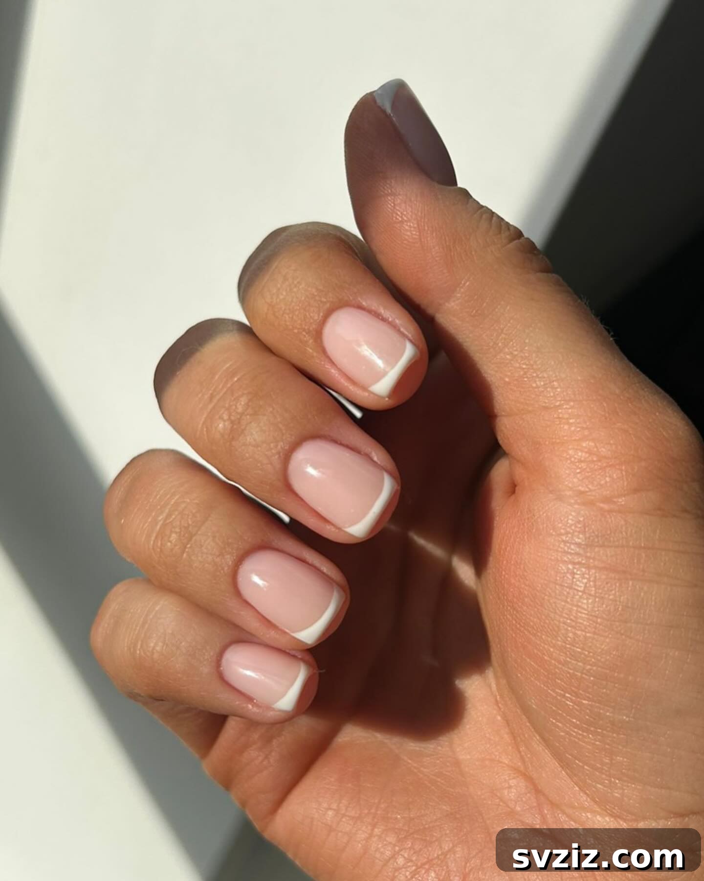 41 Effortless Nude Nail Ideas for Everyone 12 Classic and flawless nude French manicure, embodying timeless elegance and simplicity.