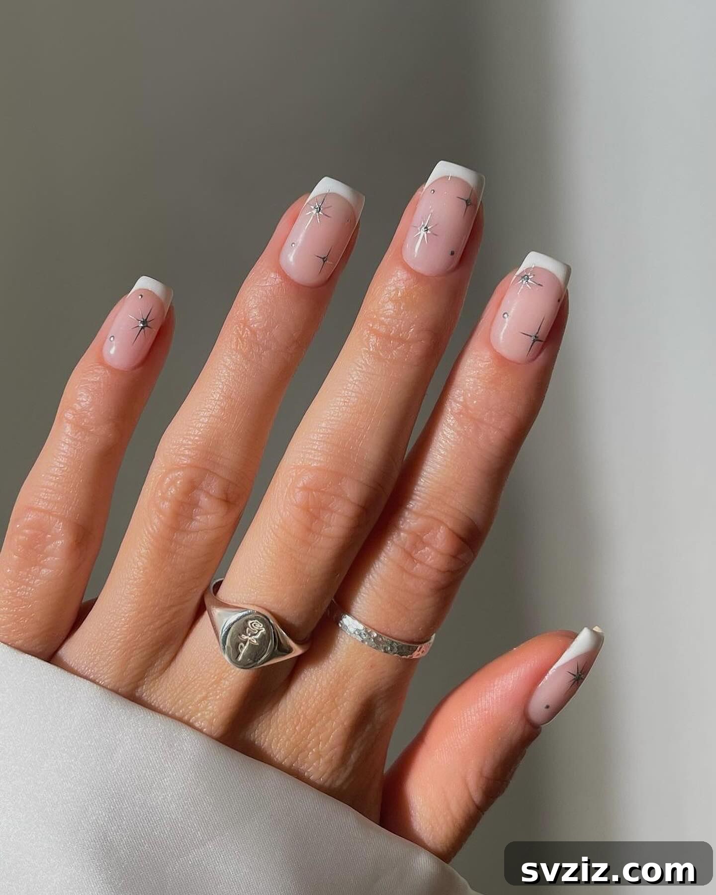 41 Effortless Nude Nail Ideas for Everyone 13 Dazzling firework French manicure, adding sparkle and celebration to classic nude nails.