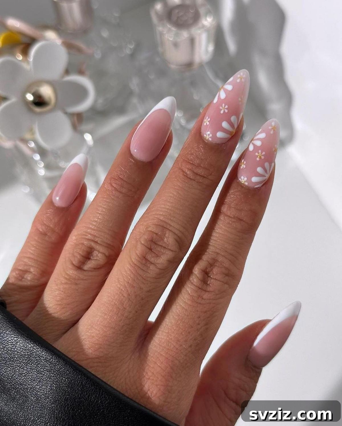41 Effortless Nude Nail Ideas for Everyone 14 Beautiful nude nails adorned with delicate floral art, ideal for spring and summer events.