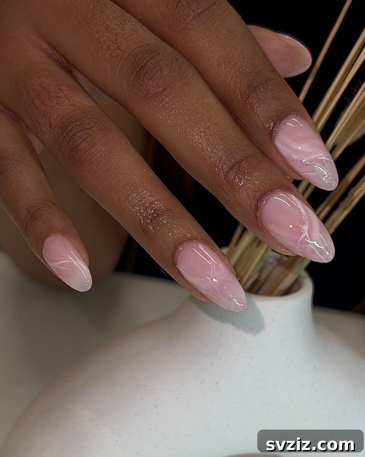 41 Effortless Nude Nail Ideas for Everyone 15 Stunning marble nude nails with pink undertones, offering a luxurious and artistic look.
