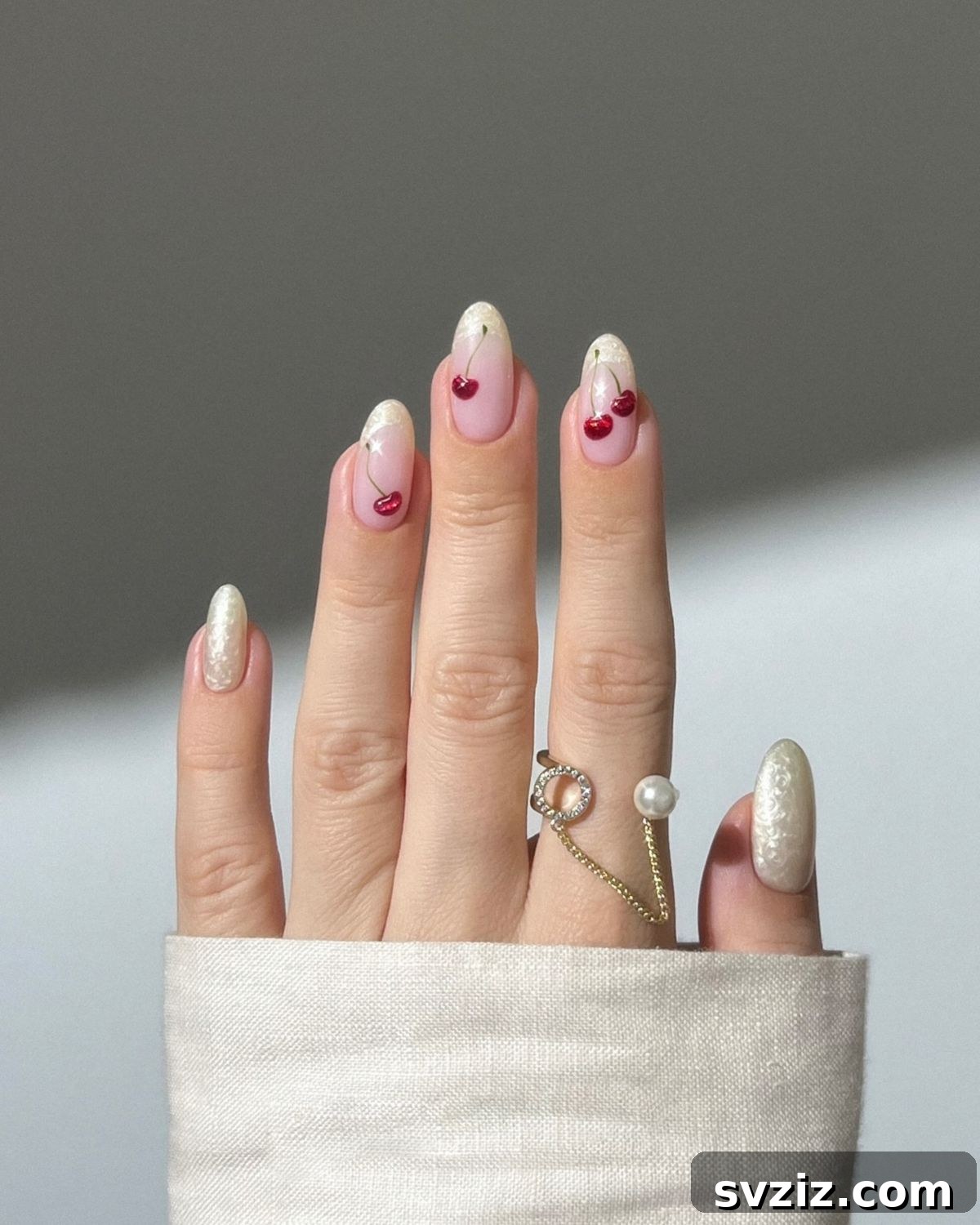 41 Effortless Nude Nail Ideas for Everyone 17 Playful cherry nail art on a soft nude background, adding a sweet and vibrant pop of color.