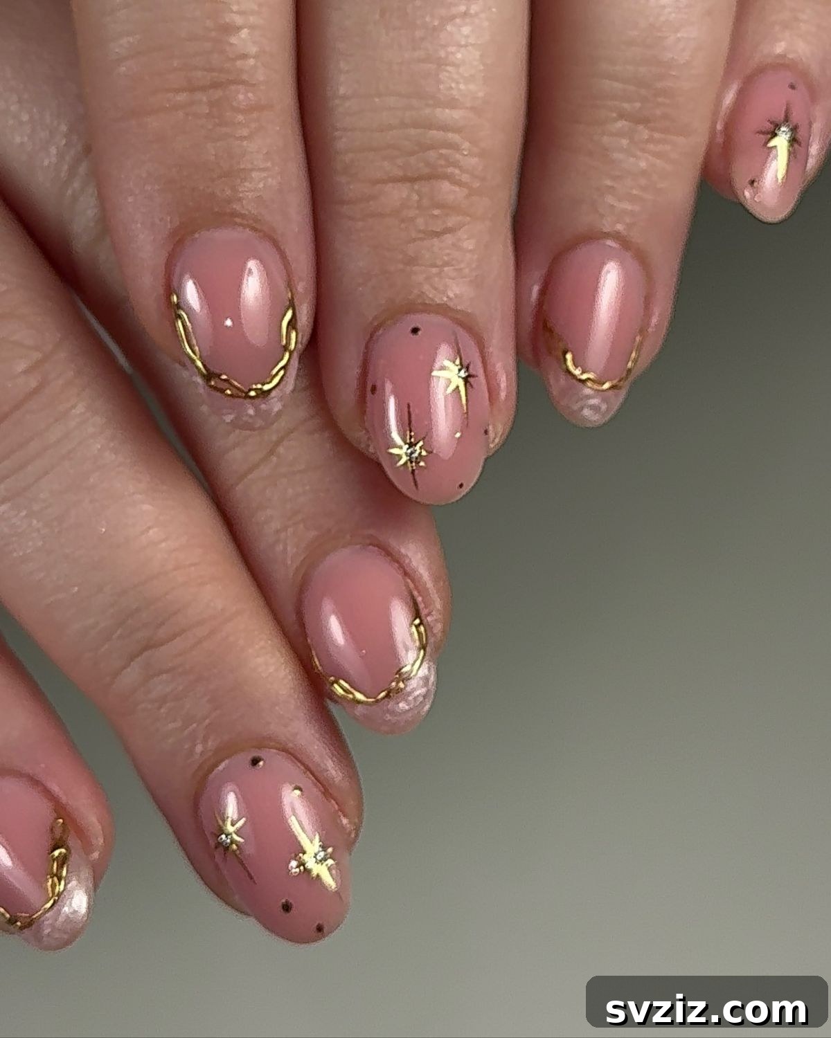 41 Effortless Nude Nail Ideas for Everyone 18 Elegant nude nails with striking gold accents, combining sophistication with eye-catching glamor.