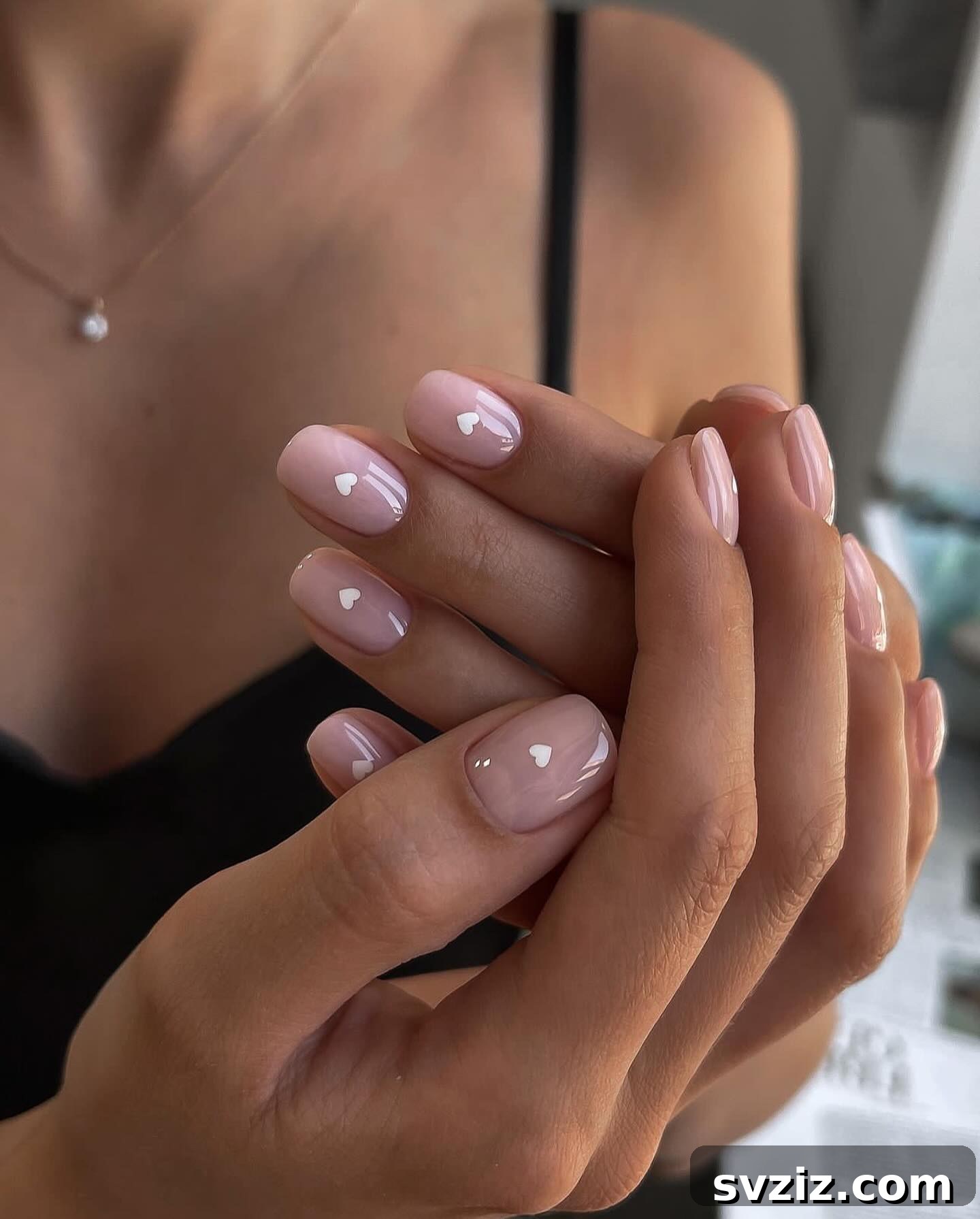41 Effortless Nude Nail Ideas for Everyone 22 Charming nude nails adorned with super cute and simple heart designs, perfect for Valentine's Day or everyday love.
