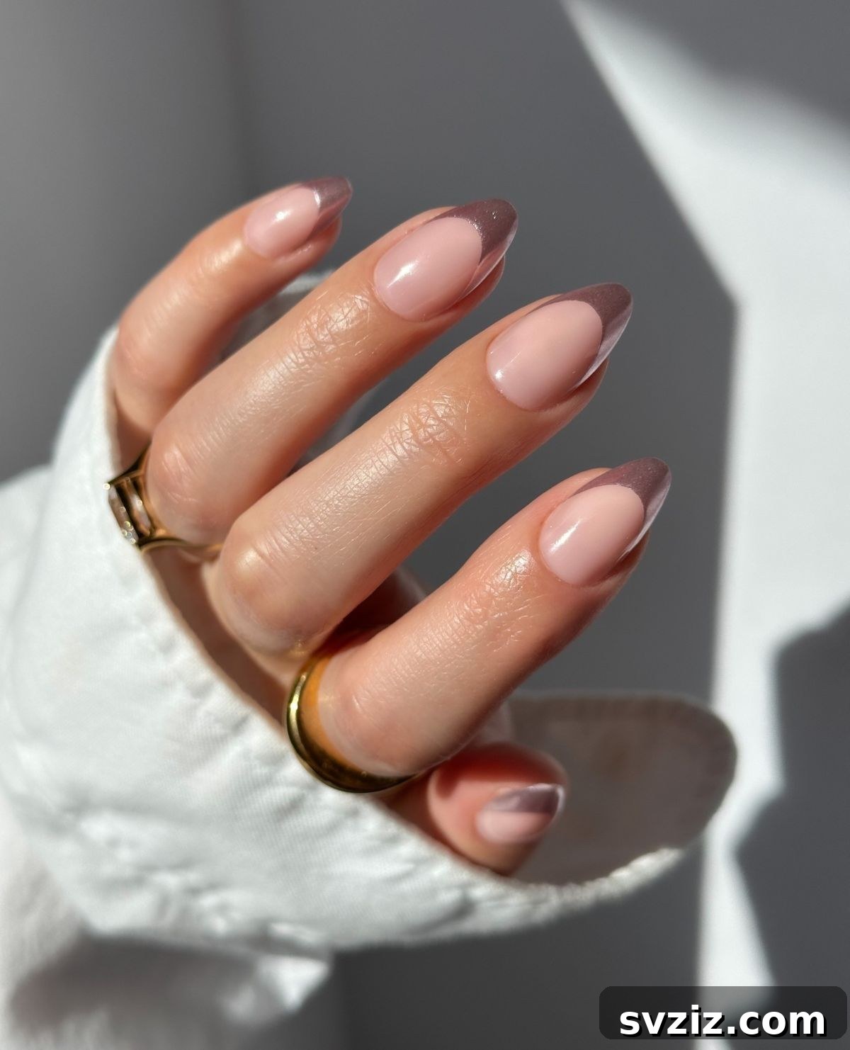 41 Effortless Nude Nail Ideas for Everyone 26 Stylish nude nails with contrasting brown tips, a perfect fall manicure idea for a modern touch.