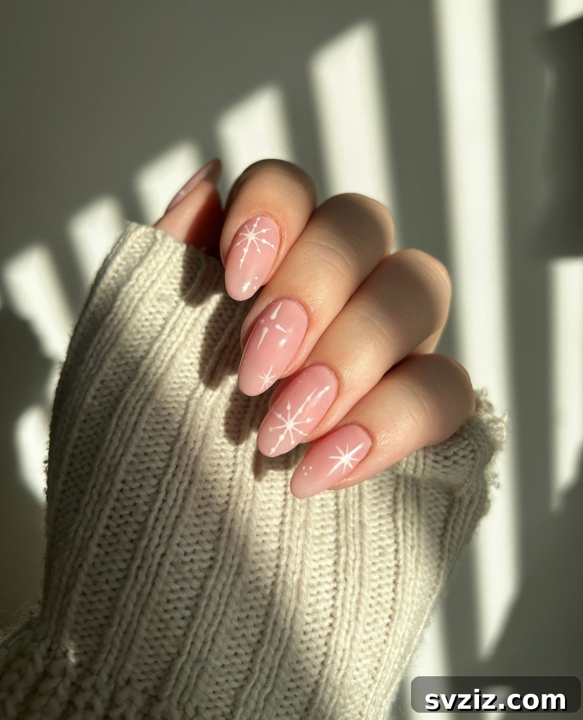 41 Effortless Nude Nail Ideas for Everyone 29 Minimalist Christmas nail art on a nude base, offering subtle yet festive holiday designs.