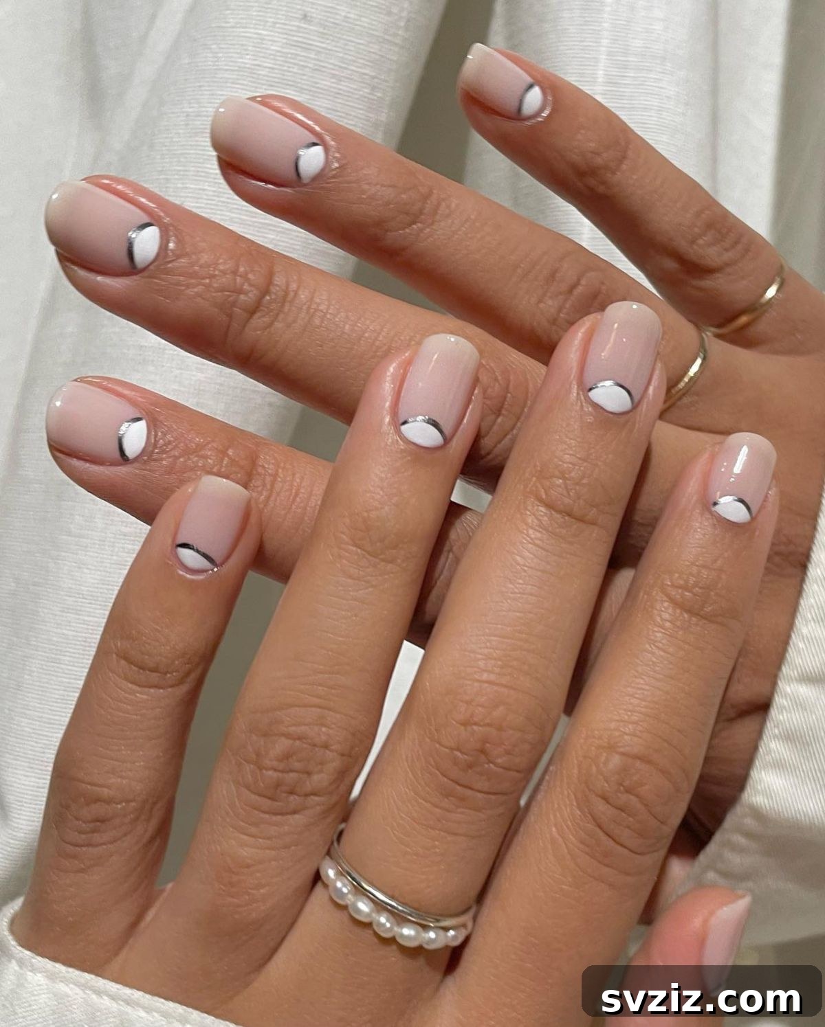 41 Effortless Nude Nail Ideas for Everyone 40 Simple and pretty neutral half-moon manicure with a touch of silver, offering an elegant and understated design.