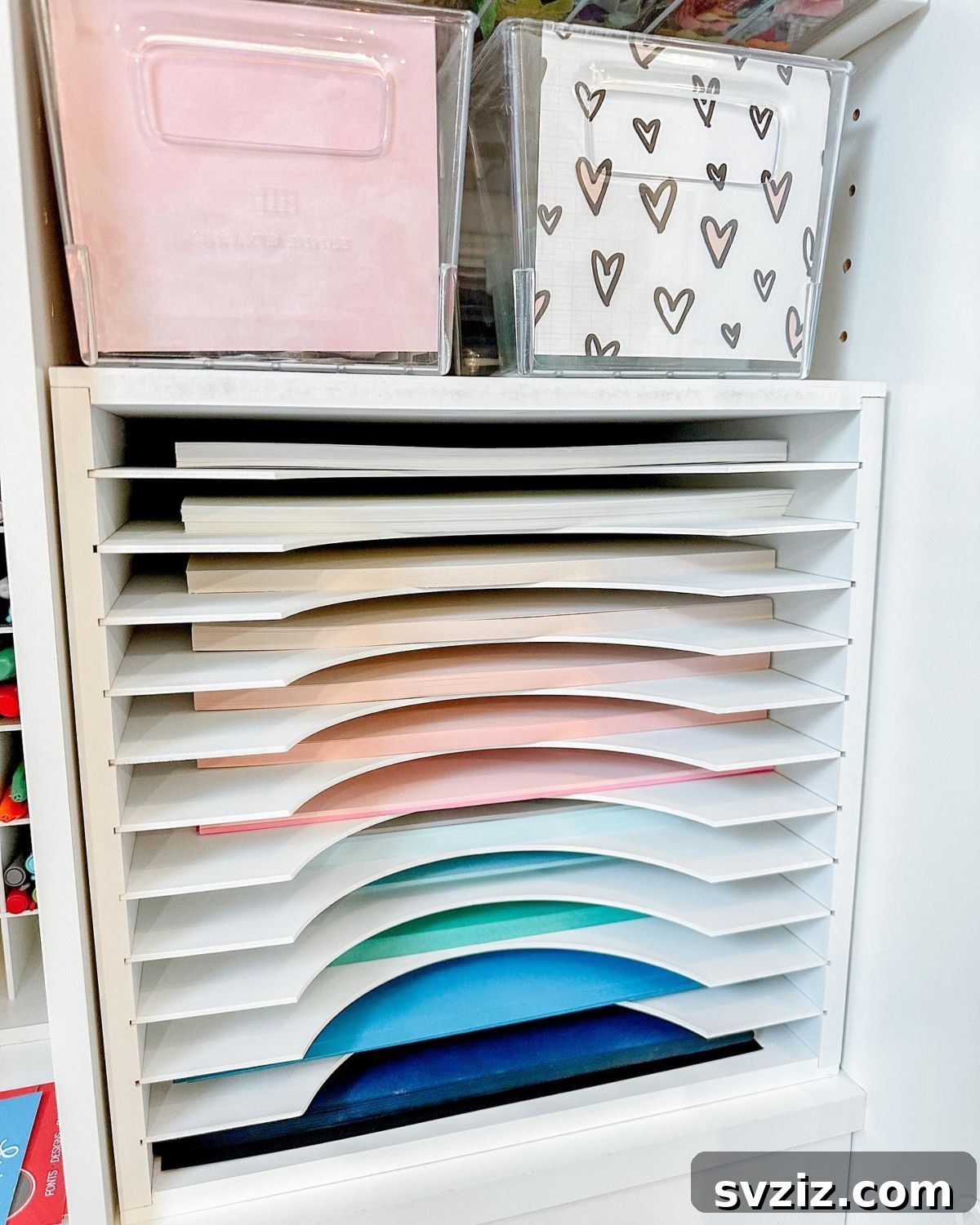 Multi-slot paper sorter neatly organizing various colors and types of craft paper.