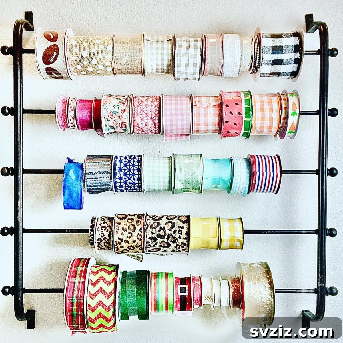 Decorative ribbon wall with multiple dowels, showcasing a large collection of ribbons in an organized manner.