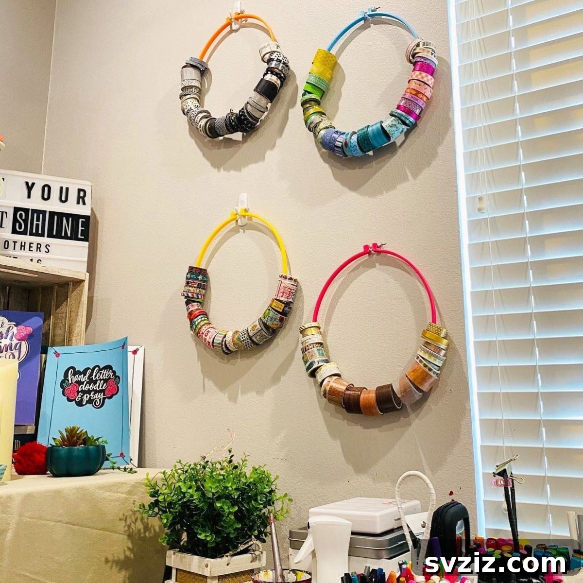 Washi tape organized creatively using embroidery hoops on a wall, adding a decorative touch.