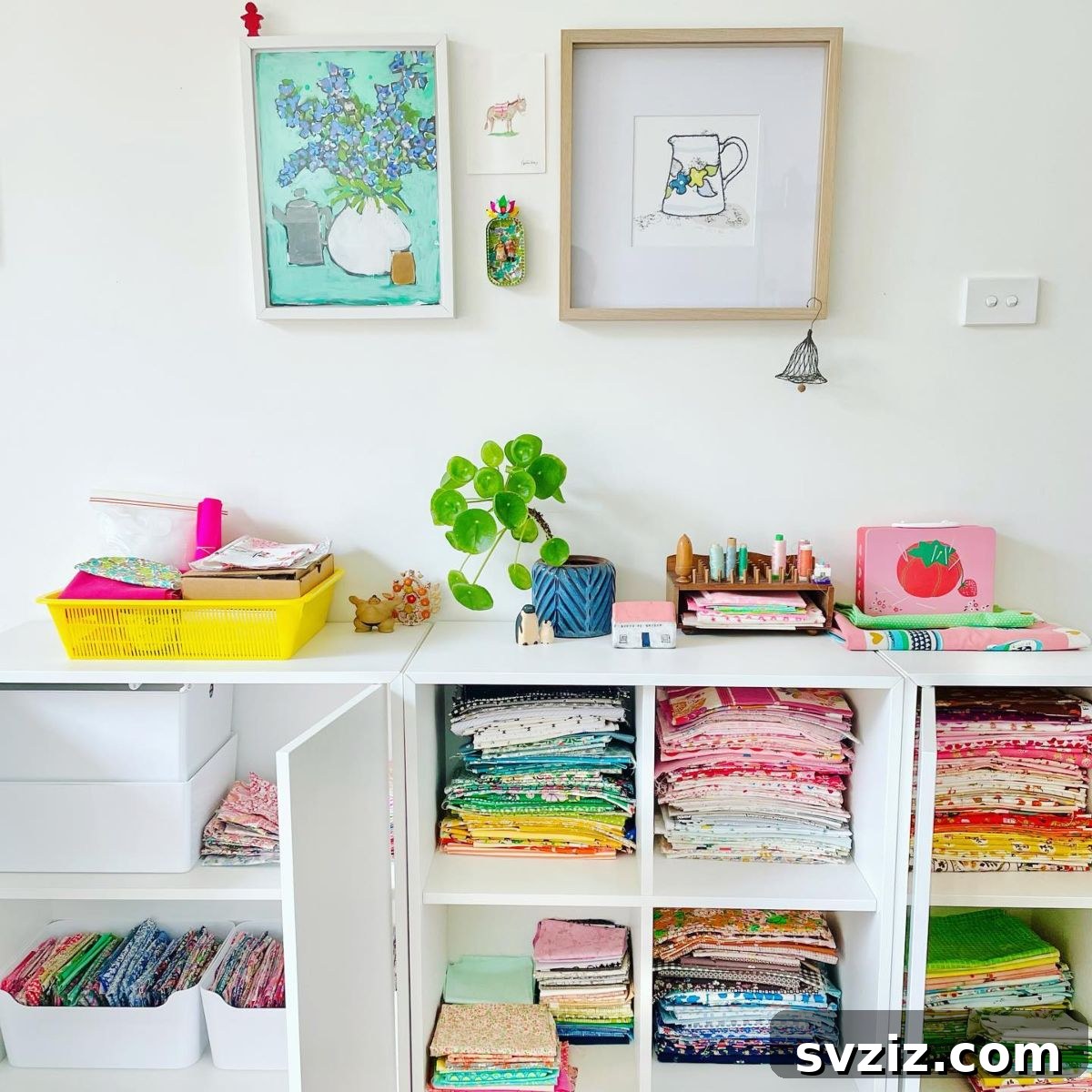 Open shelving unit organizing fabric rolls and folded pieces, creating easy access for a seamstress.