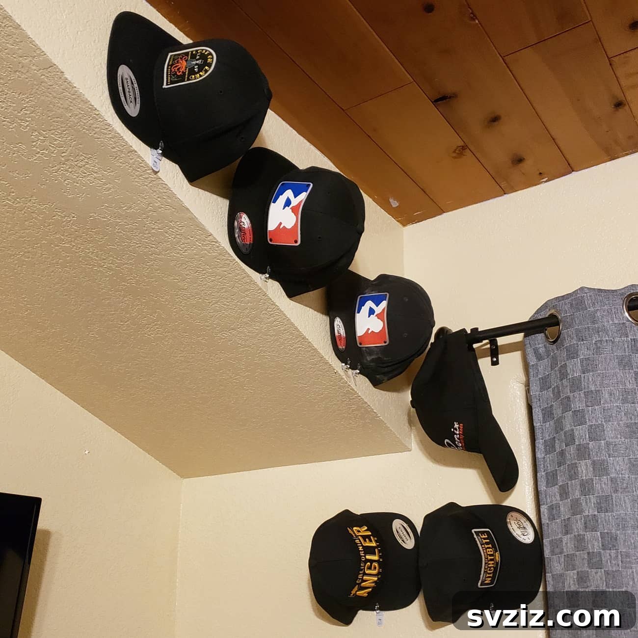 27 Genius Command Hook Hacks for an Organized Home 11 Organize Caps with Command Hooks