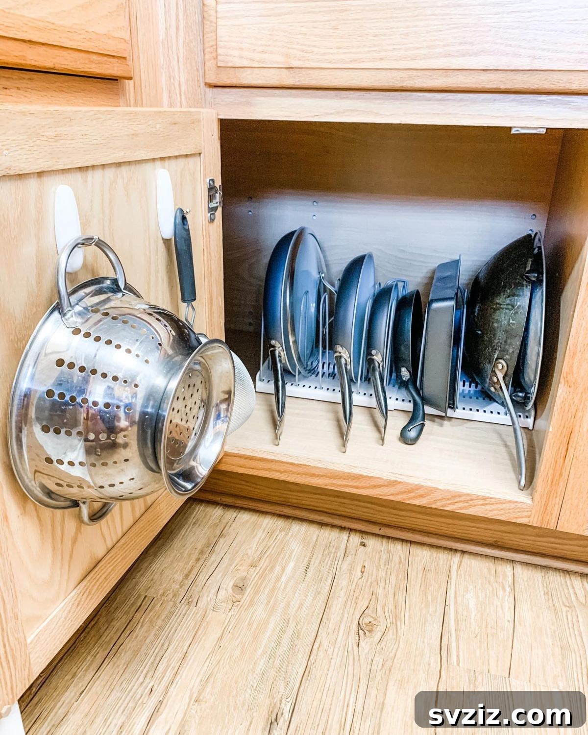 27 Genius Command Hook Hacks for an Organized Home 19 Organize Pots and Pans with Command Hooks