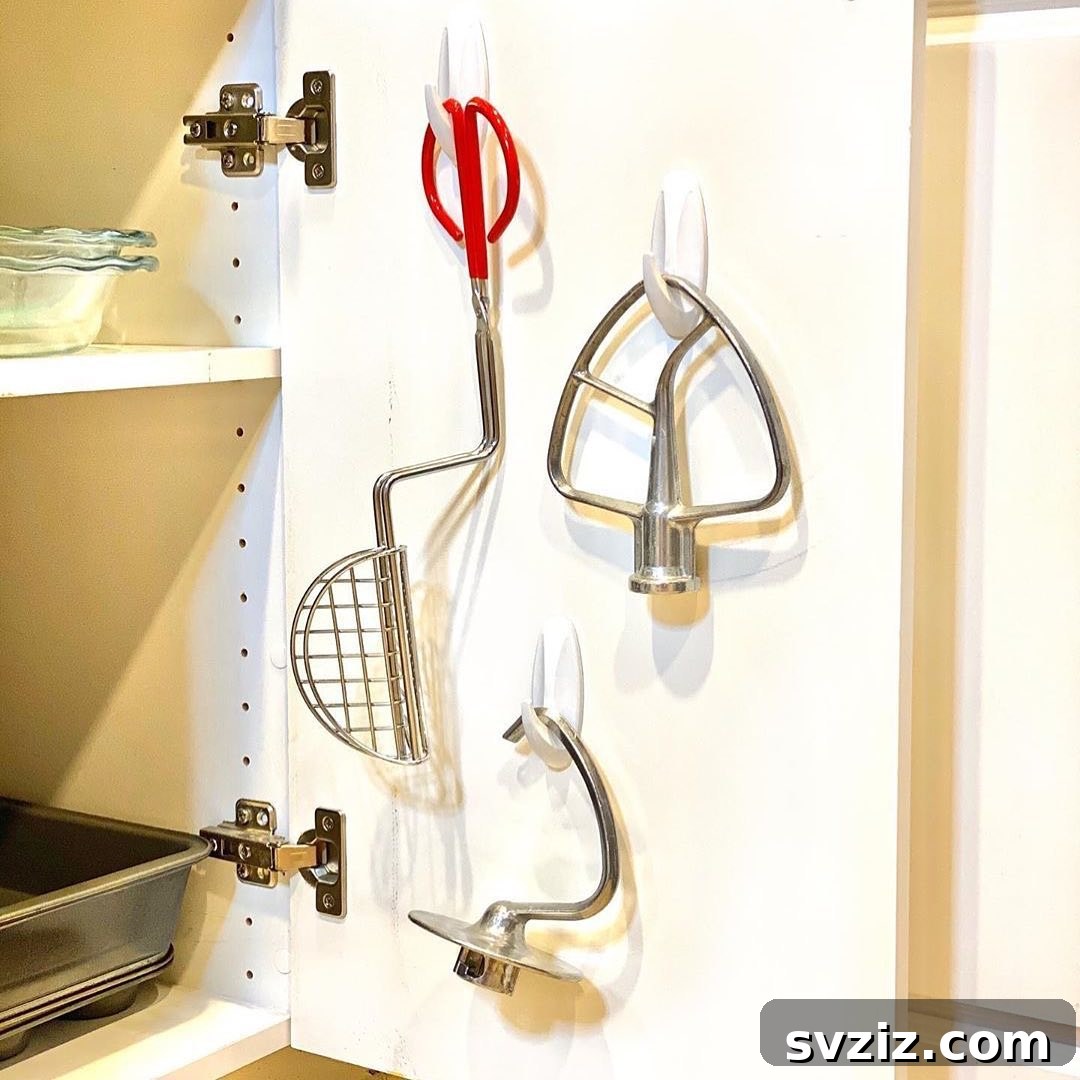 27 Genius Command Hook Hacks for an Organized Home 21 Organize Mixer Attachments with Command Hooks