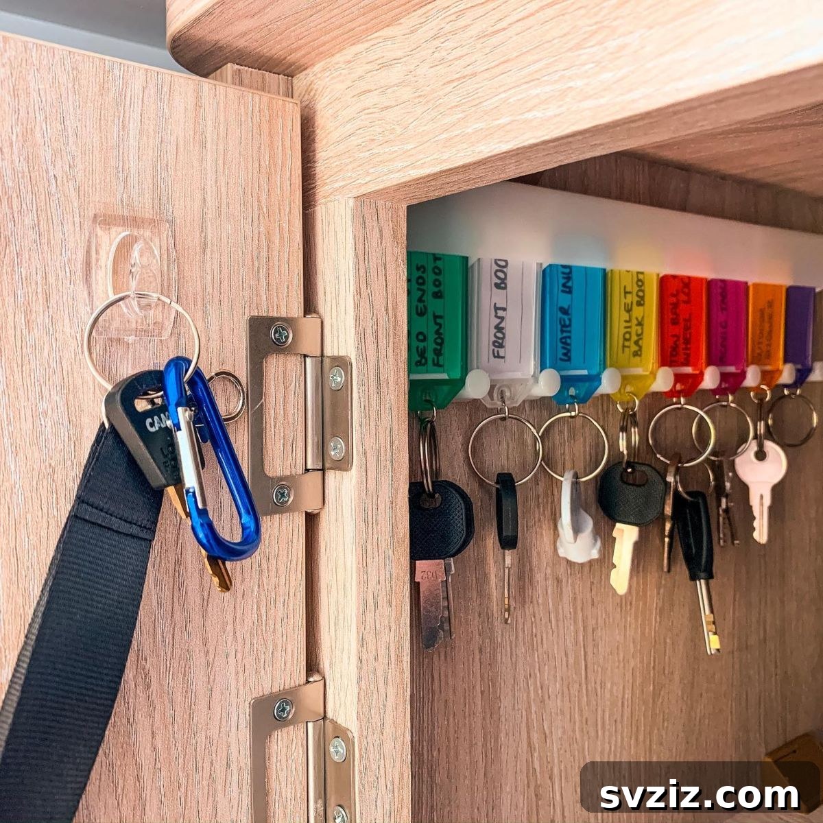 27 Genius Command Hook Hacks for an Organized Home 23 Color Coded Key Organization with Command Hooks