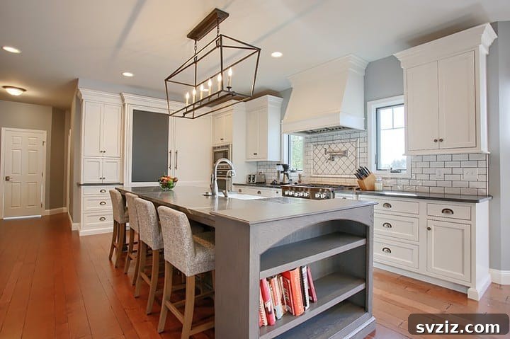 Kitchen island with customized cabinetry including open shelves and closed compartments