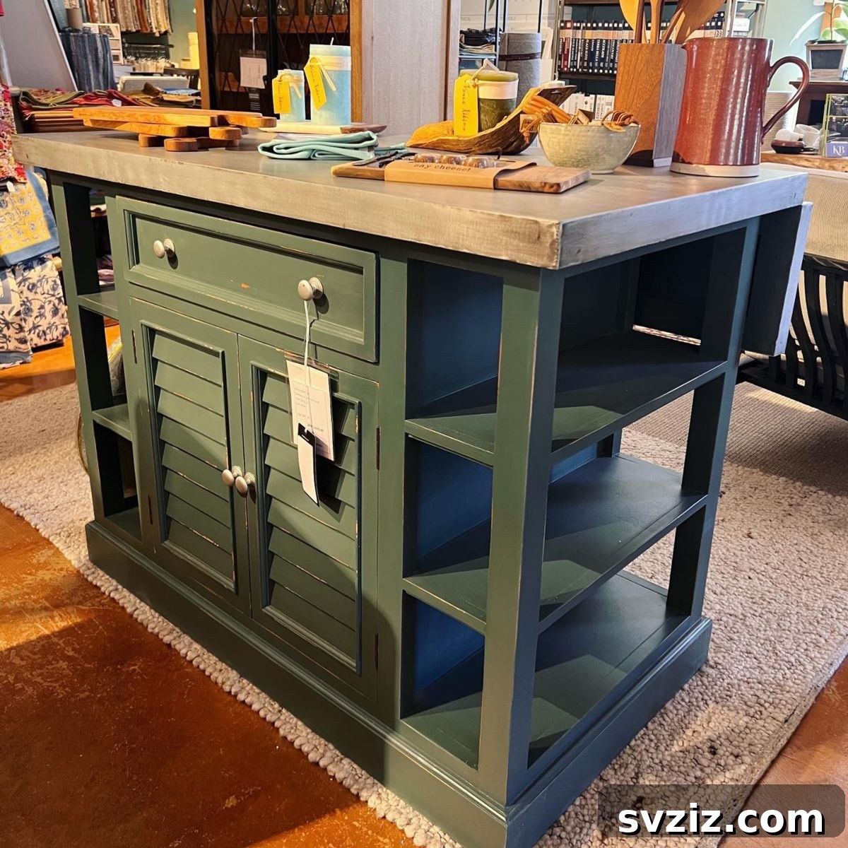 Kitchen island with a hinged overhang that can be lifted to create seating
