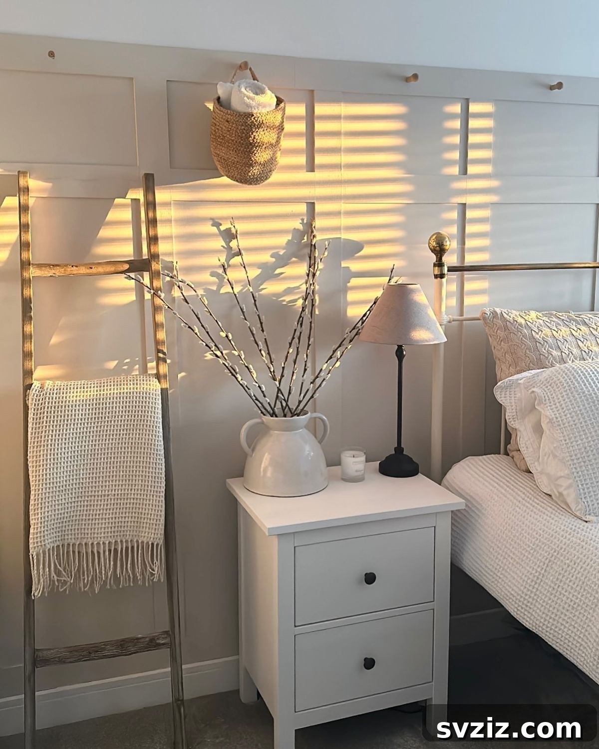 Unlock Every Inch: 21 Vertical Bedroom Organization Secrets 21 19. Ladder Blanket Storage