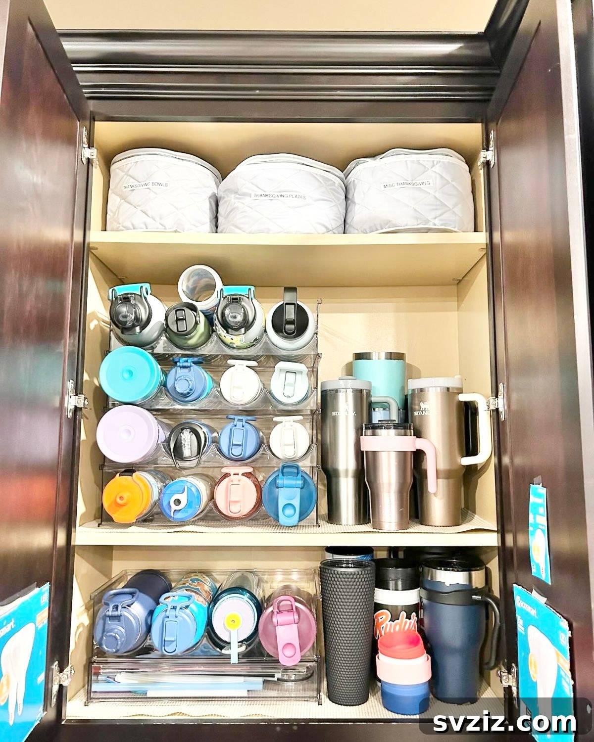 21 Brilliant Tricks for Your Ultimate Clutter-Free Home 14 Organizing water bottles in a dedicated cupboard with stands