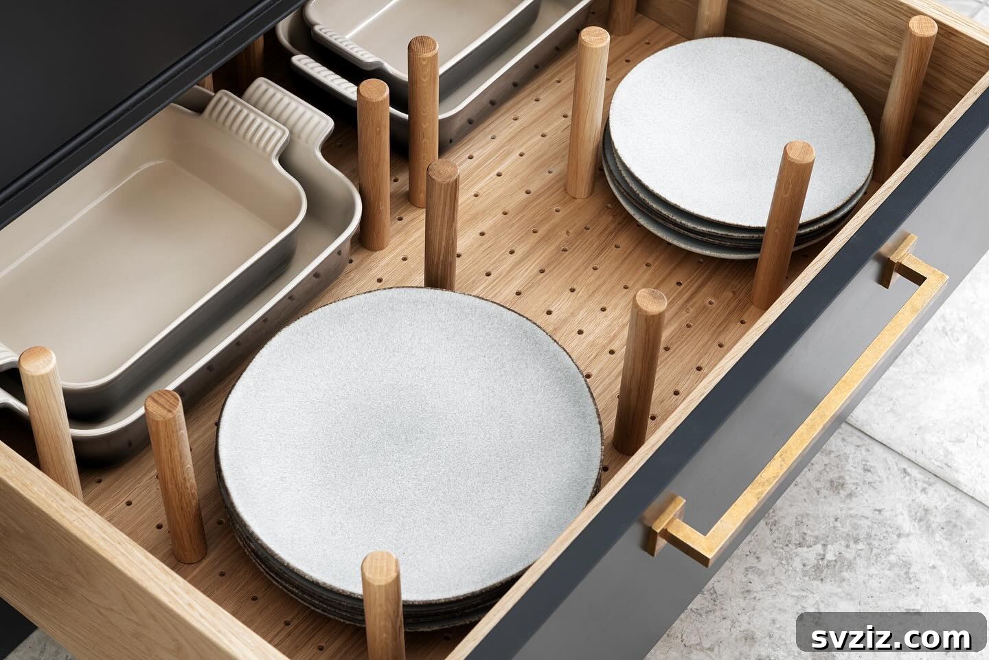 Smart Plate Organization Ideas for a Perfectly Tidy Kitchen 5 Kitchen drawer organized with a pegboard system, holding plates and bowls securely in place with movable pegs.