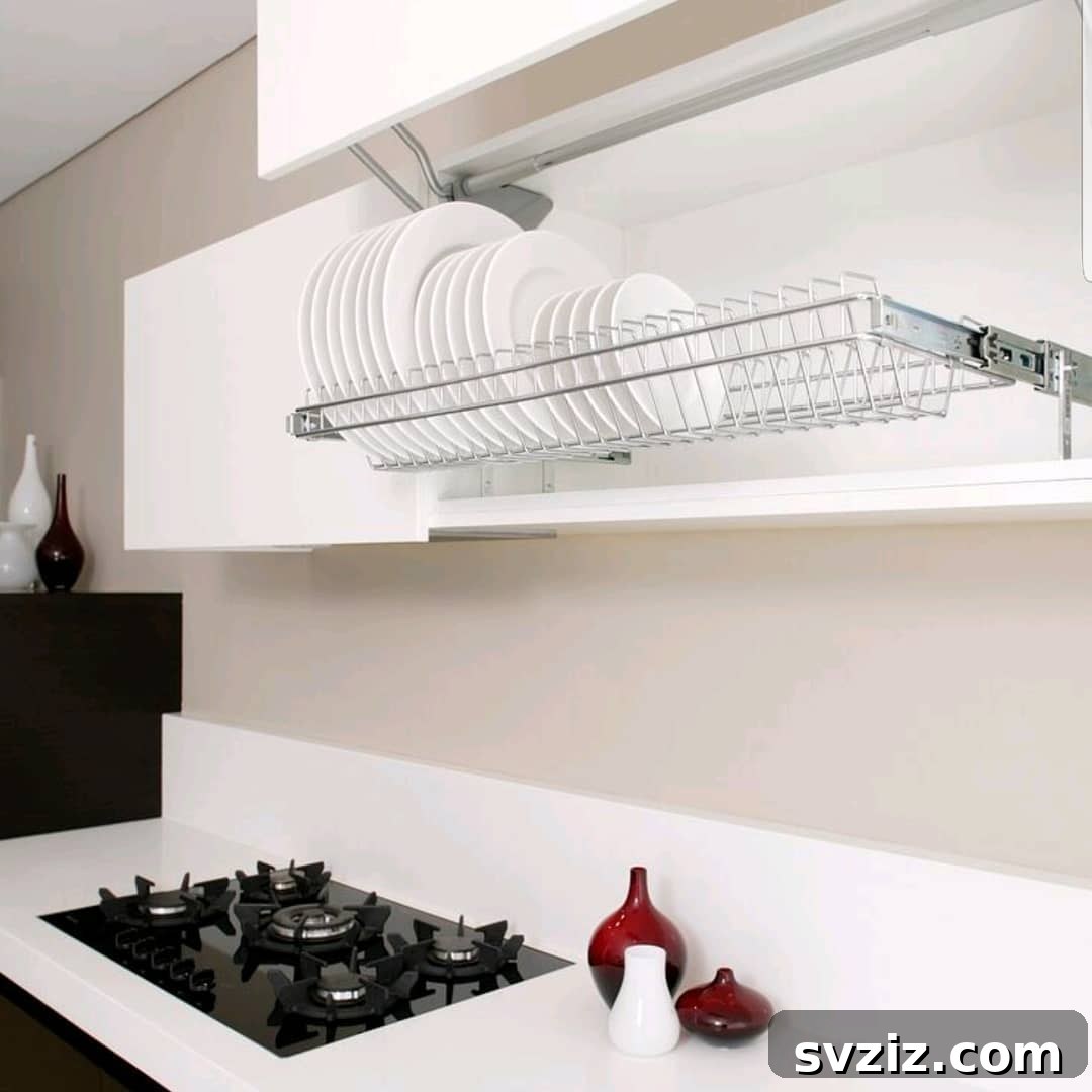Smart Plate Organization Ideas for a Perfectly Tidy Kitchen 8 Extendable overhead plate storage rack in a kitchen, lowering plates for easy access and drying.