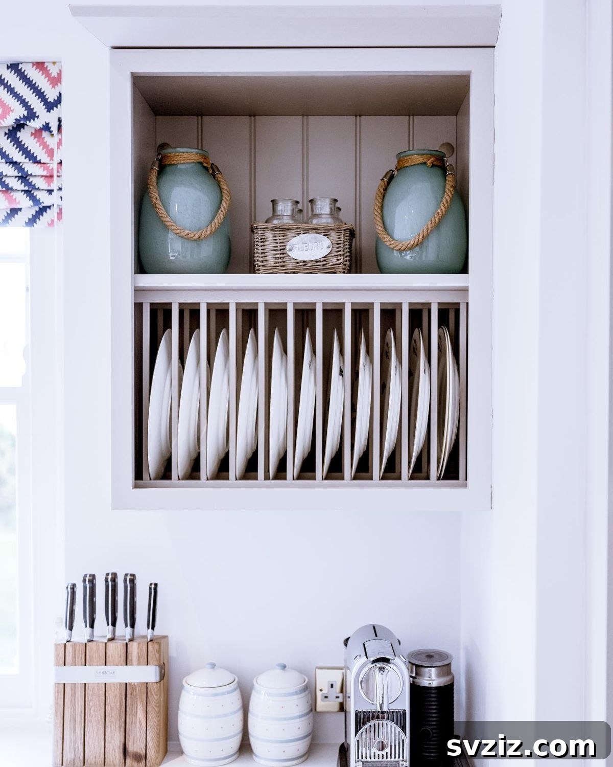Smart Plate Organization Ideas for a Perfectly Tidy Kitchen 10 Elegant kitchen featuring a built-in vintage-style wooden plate rack with individual slots for plates.