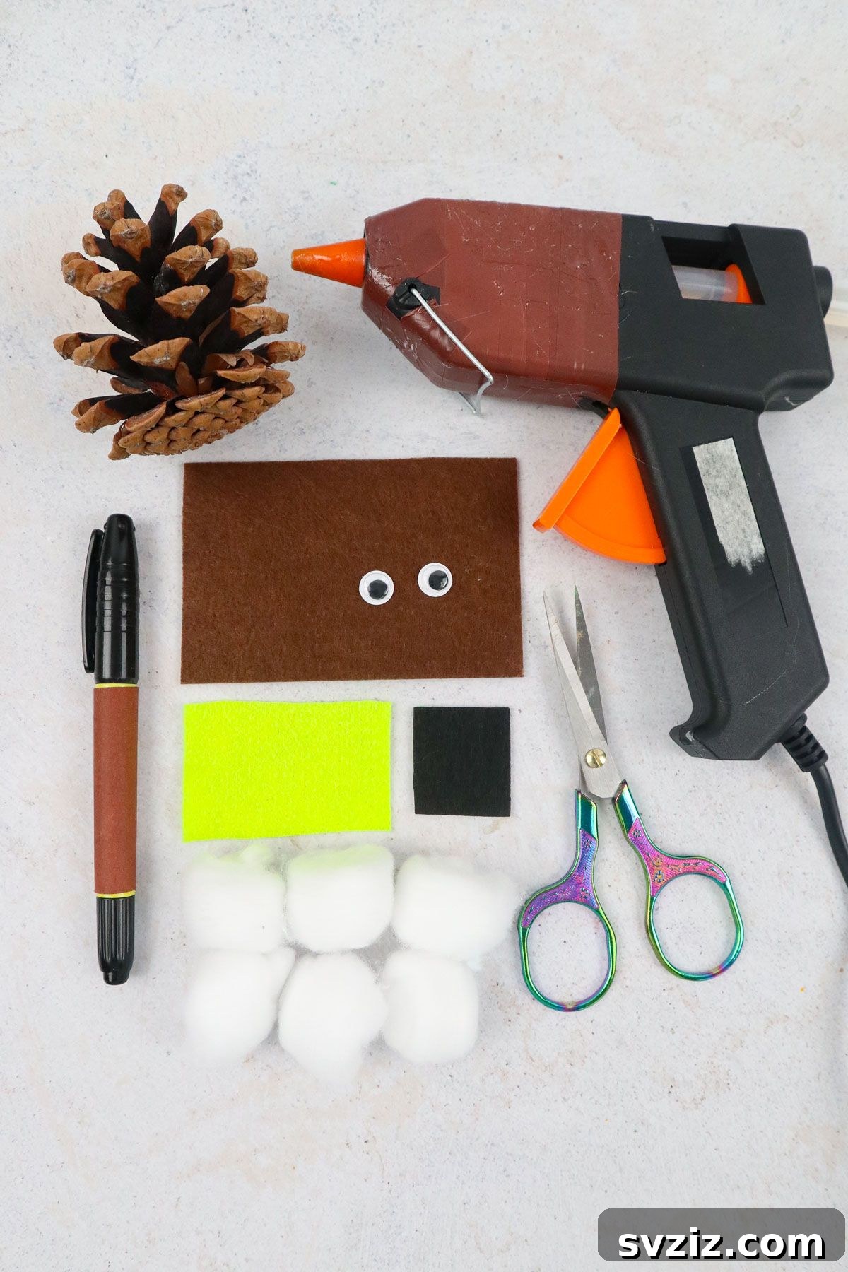 Winter Wonderland Owl Project 3 All the essential materials laid out for making the Creative Owl Craft, including pinecones, felt, and googly eyes