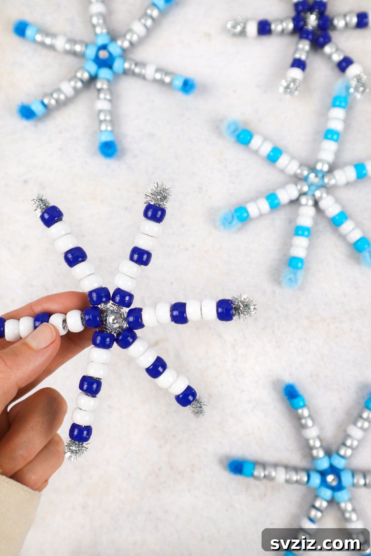 Fun Pipe Cleaner Snowflakes in various colors and patterns