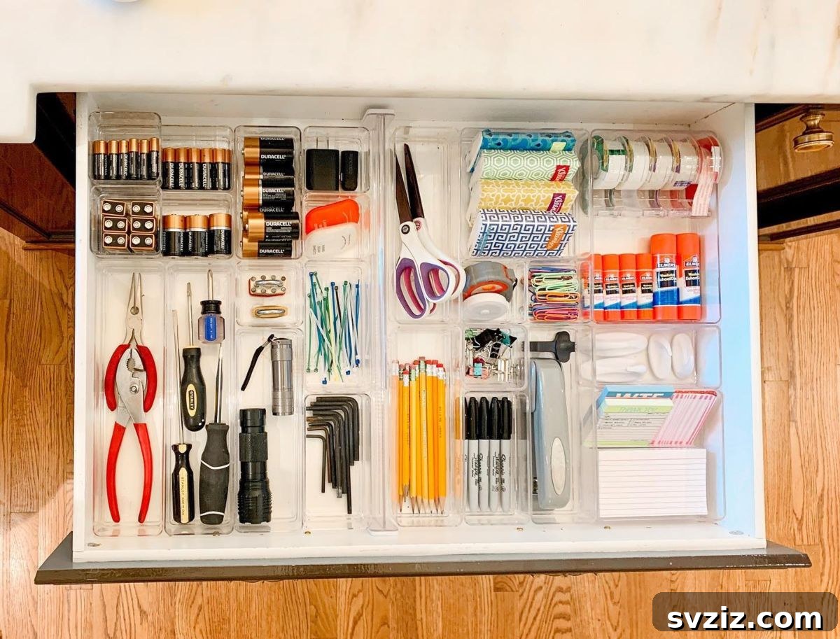 25 Genius Desk Drawer Organization Tips 11 A chic utilitarian drawer with modular organizers and essential items