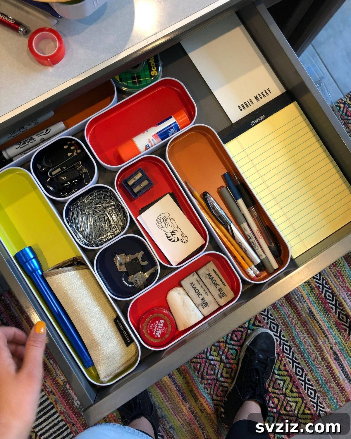 25 Genius Desk Drawer Organization Tips 14 Desk drawer organized with stylized metal dividers featuring colored bases