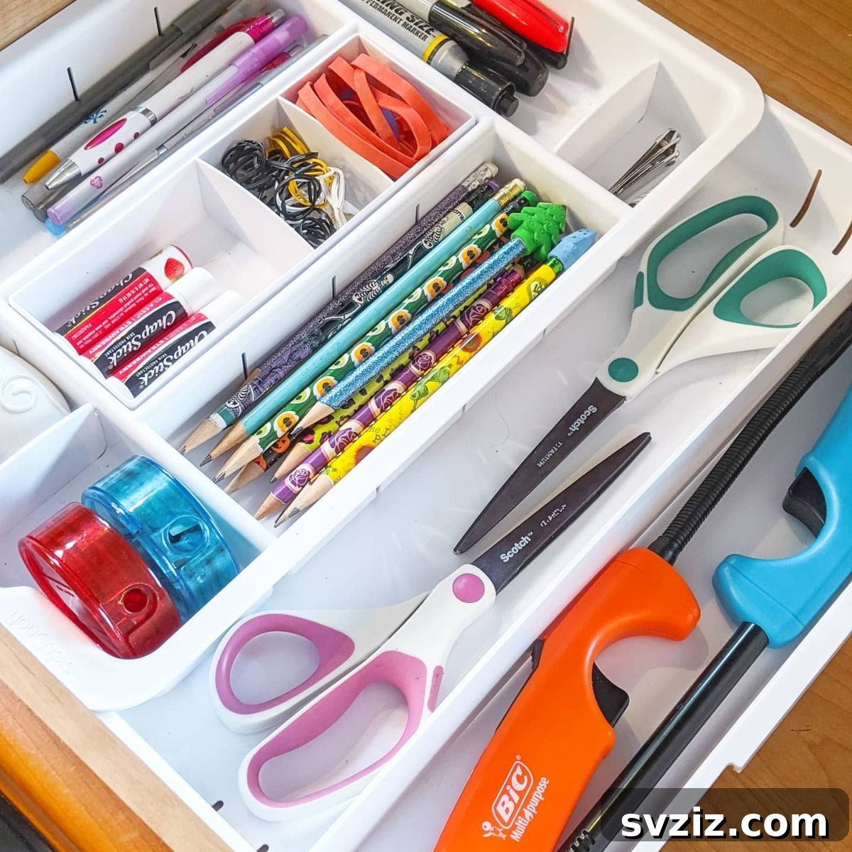 25 Genius Desk Drawer Organization Tips 19 Desk drawer organized with a repurposed cutlery divider for office supplies