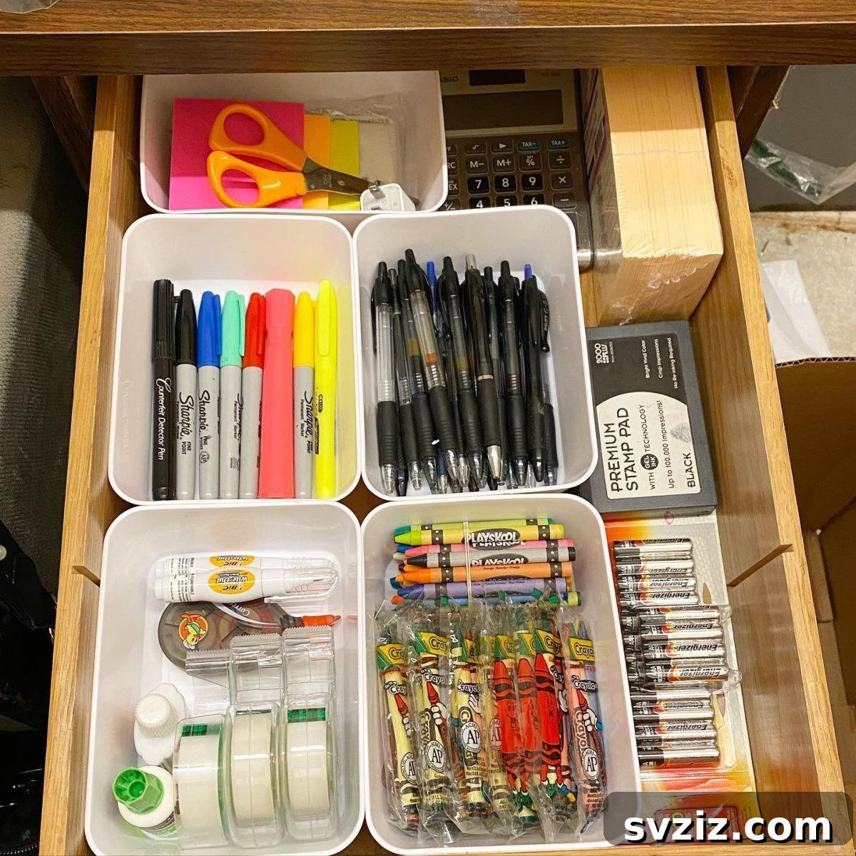 25 Genius Desk Drawer Organization Tips 6 Desk drawer organized with various simple white containers
