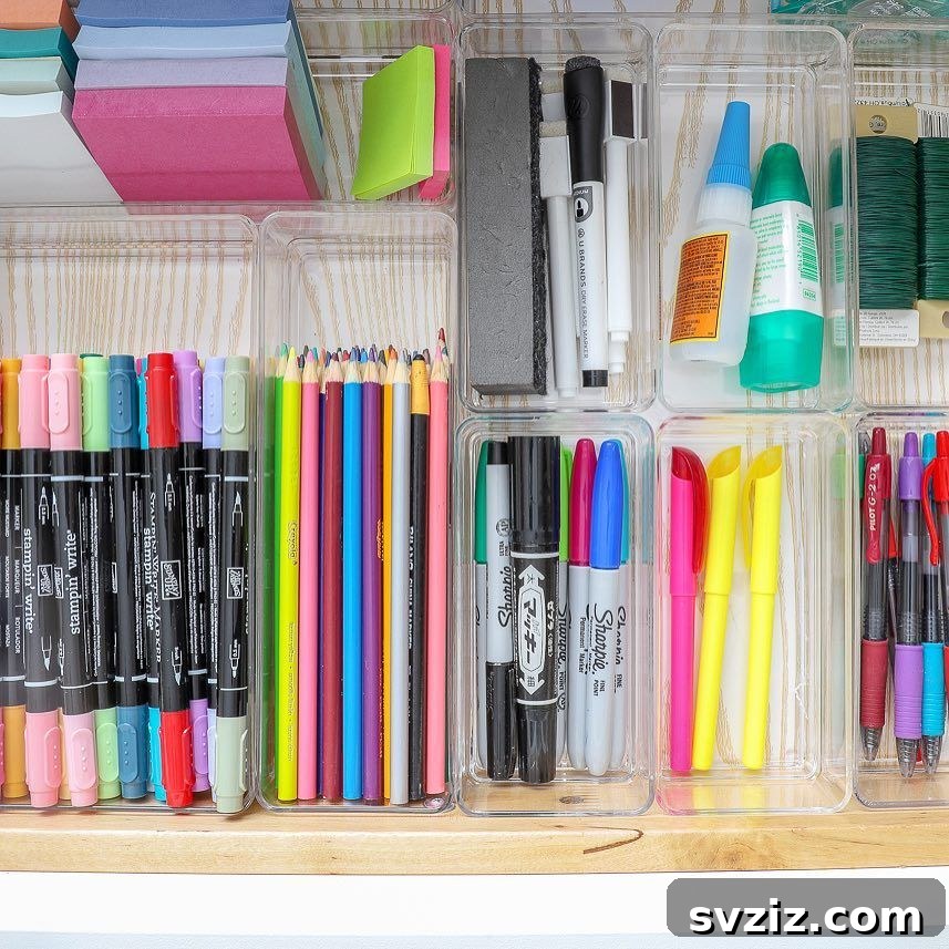 25 Genius Desk Drawer Organization Tips 7 Desk drawer with grey plastic modular organizers for various items