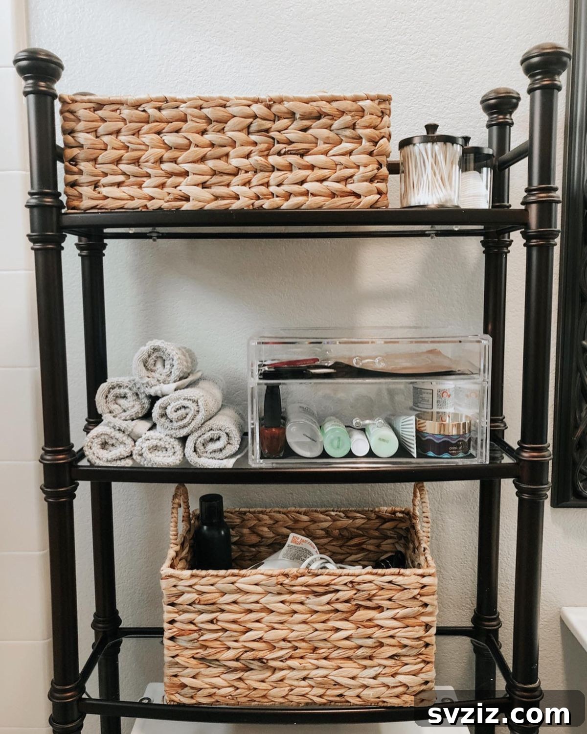 21 Smart Ways to Utilize the Space Above Your Toilet 11 Bathroom with over-the-toilet wicker baskets for storage.