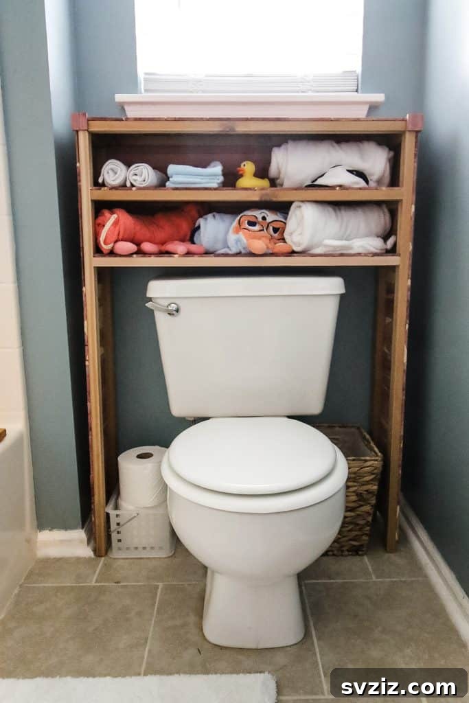 21 Smart Ways to Utilize the Space Above Your Toilet 15 Rustic DIY wooden storage shelves built over a toilet.