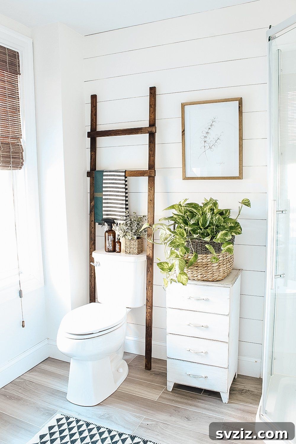 21 Smart Ways to Utilize the Space Above Your Toilet 19 Rustic DIY wooden ladder used for towel storage in a bathroom.