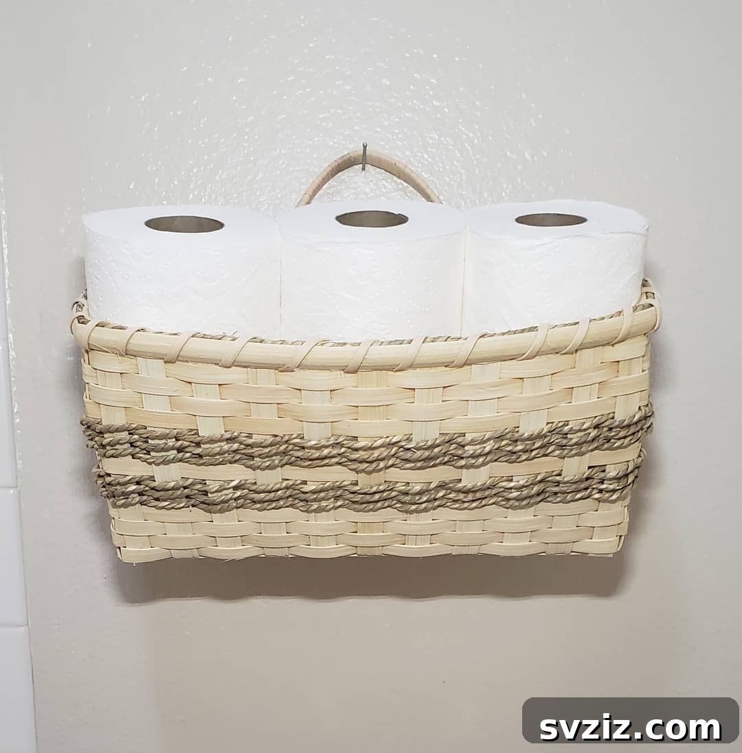 21 Smart Ways to Utilize the Space Above Your Toilet 20 Cute hanging basket for toilet paper storage in a bathroom.