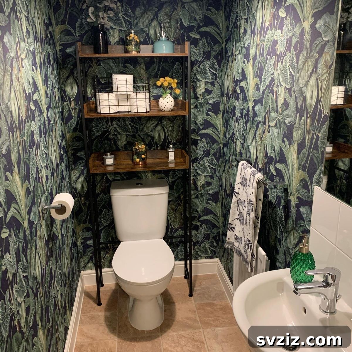 21 Smart Ways to Utilize the Space Above Your Toilet 21 Minimalist bathroom with a black wire basket for storage above the toilet.
