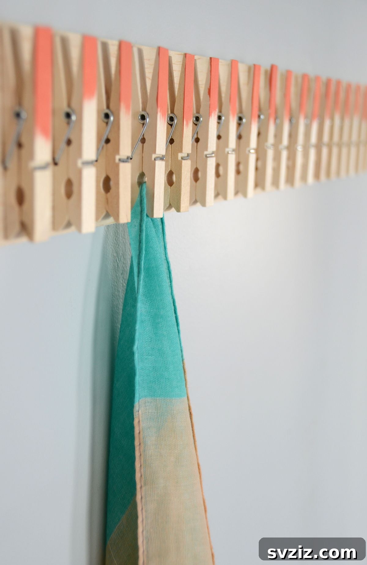 21 Brilliant Clothespin Organization Ideas to Simplify Your Space 19 17. Scarf Holder