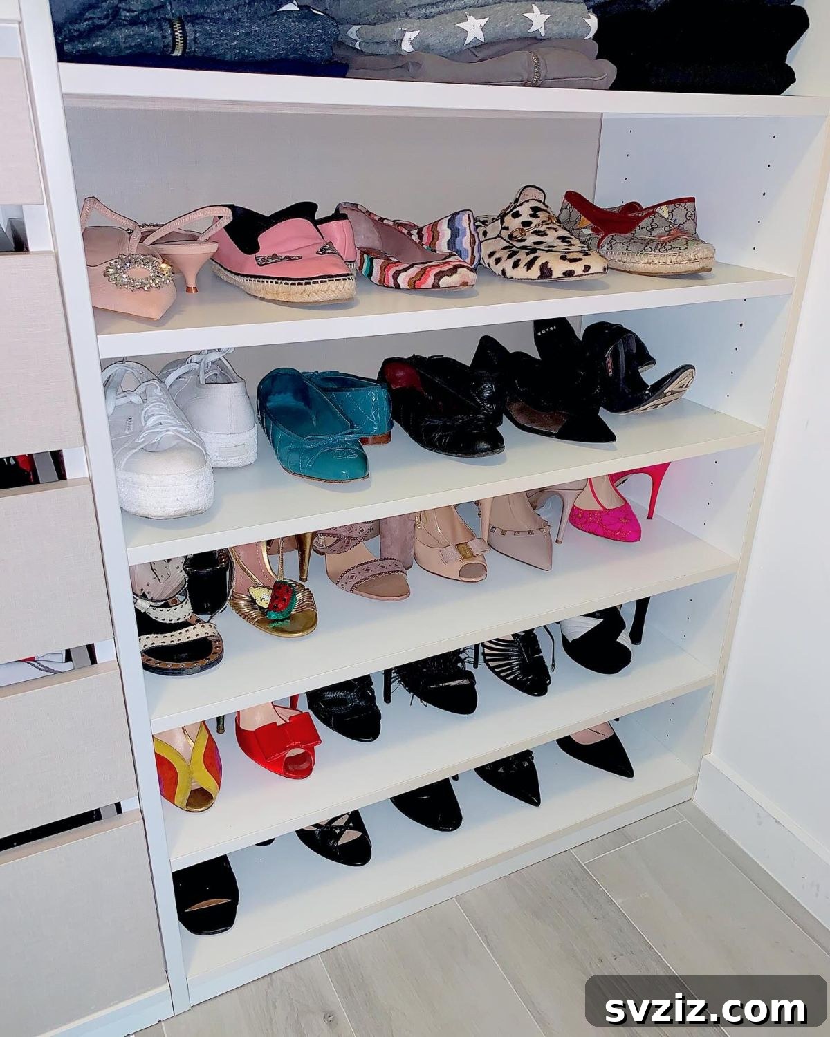 Impressively organized shoe wall in a custom closet
