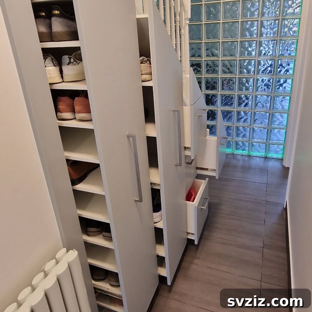 Custom built-in under stairs shoe storage shelves