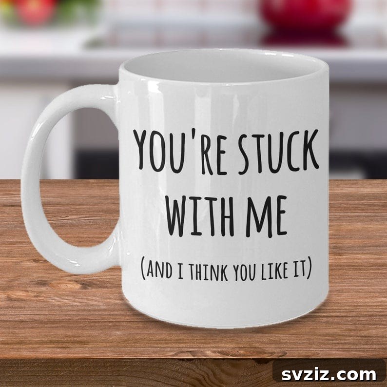 15 Stellar Valentine's Gifts to Spoil Your Man 4 A humorous coffee mug reading 'You're stuck with me,' perfect for a Valentine's Day gift.