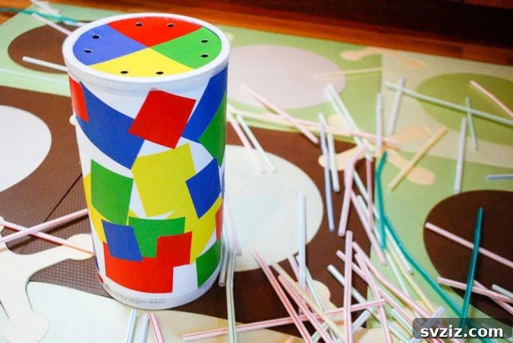 Engaging Toddler Straw Game from an oatmeal canister